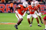 Miami defensive lineman Rueben Bain Jr. (4) runs a play during an NCAA football game against...