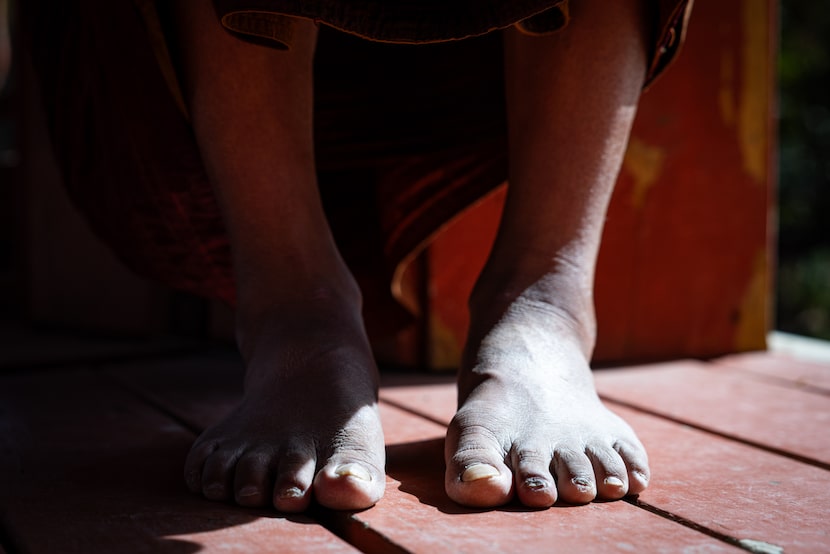 The feet of Bhikkhu Pannakara, a Buddhist monk, who led a 2,300-mile trek from Fort Worth to...