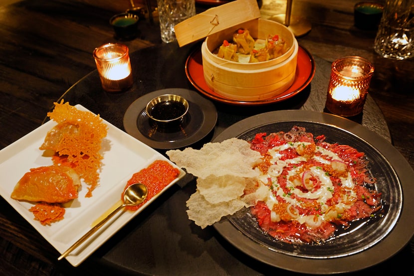 Wagyu cheeseburger potstickers (left), shrimp and chicken sui mai (top) and beef carpaccio...