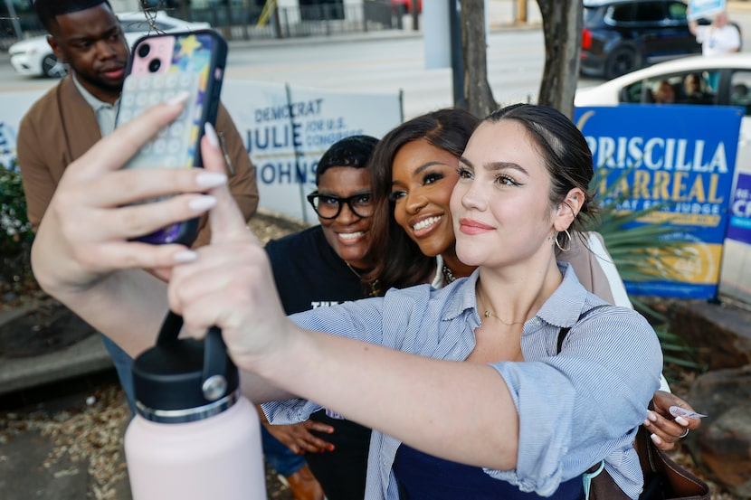 Chitra Calderon, 20, takes a selfie with U.S. Rep. Jasmine Crockett, Democratic primary...