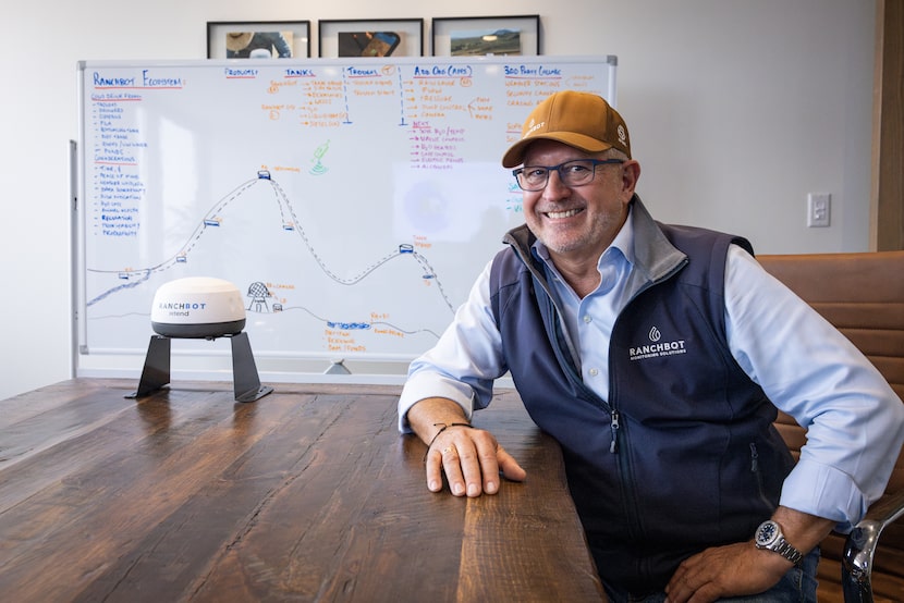 Andrew Coppin, co-founder and CEO of Ranchbot Monitoring Solutions, sits at a conference...