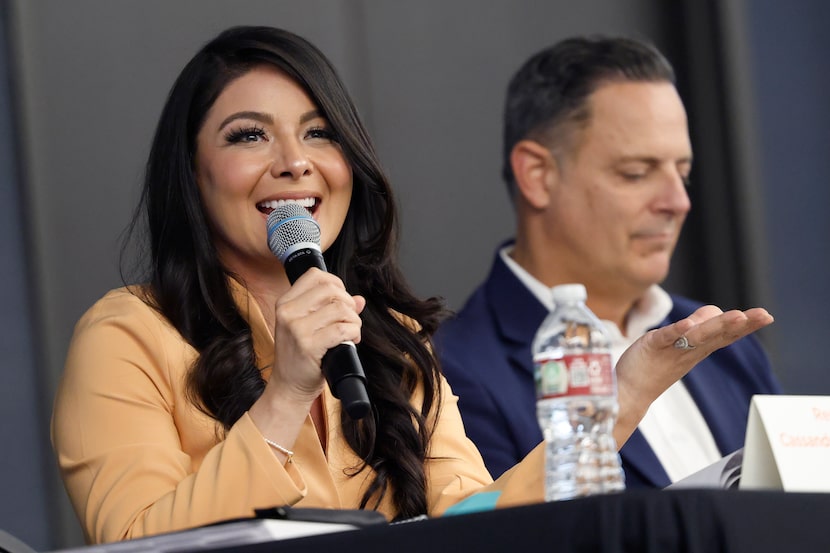 State Representatives Cassandra Garcia-Hernandez of District 115 (left) responds to a...