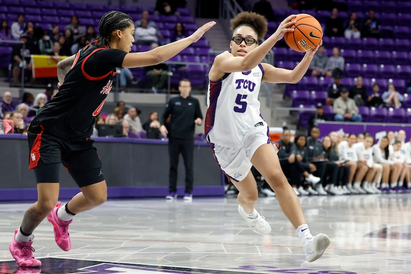 Texas Christian University Horned Frogs guard Olivia Miles (5) drives to the lane past...