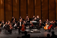Cellist Alexander Hersh acknowledges applause after performing with the Dallas Chamber...