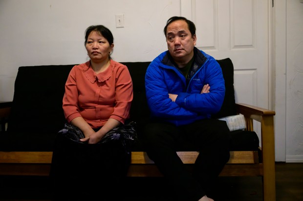 Thi Dua Vang with her and husband Apao Yang talk to a reporter at an undisclosed location