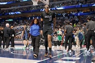 Dallas Mavericks forward Daniel Gafford (21) leaves after he was injured during the first...