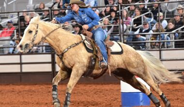 Katelyn Scott running barrels at FWSSR on Peanut Seed the horse