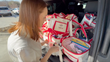 Faith Shields loads care baskets in Plano to deliver to families at Medical City Children's Hospital.