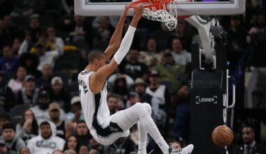 San Antonio Spurs forward Victor Wembanyama (1) scores against the Orlando Magic during the first half of an NBA basketball game in San Antonio, Sunday, Feb. 1, 2026. (AP Photo/Eric Gay)
