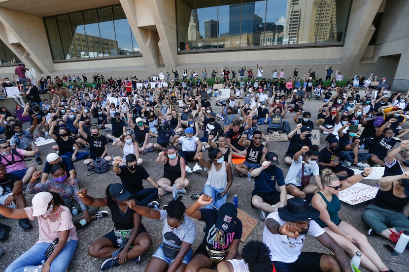 Protesters gathered in front of Dallas City Hall for an eight-minute, 46-second moment of...