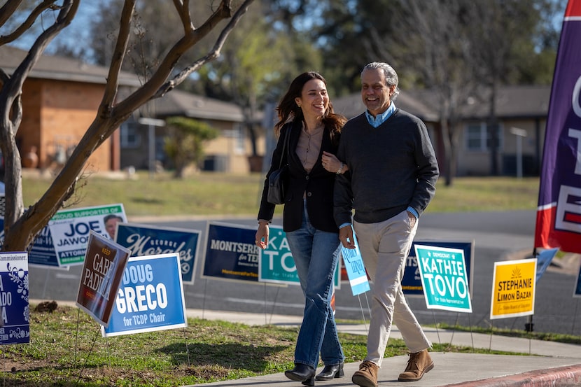 At left, State Rep. Gina Hinojosa, a democrat candidate for governor, walks to cast her...
