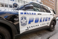 A Dallas police patrol car pictured along Commerce Street after a shooting at the...