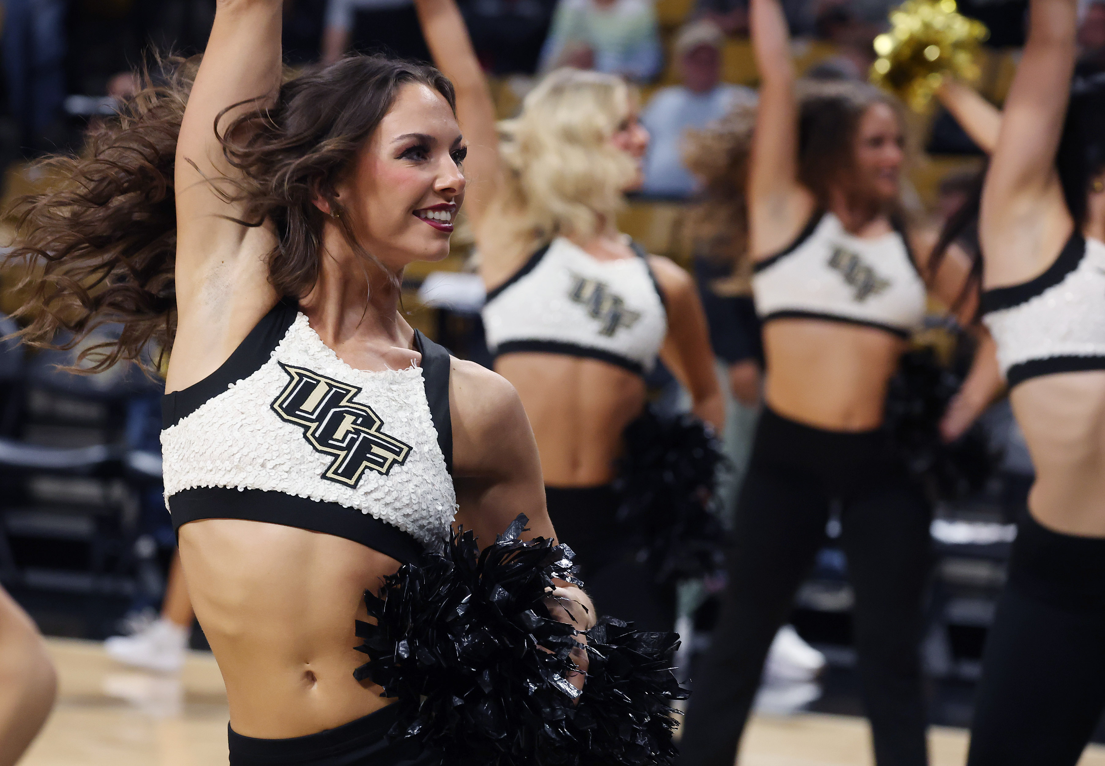 UCF dancers cheer during the TCU at UCF college basketball...