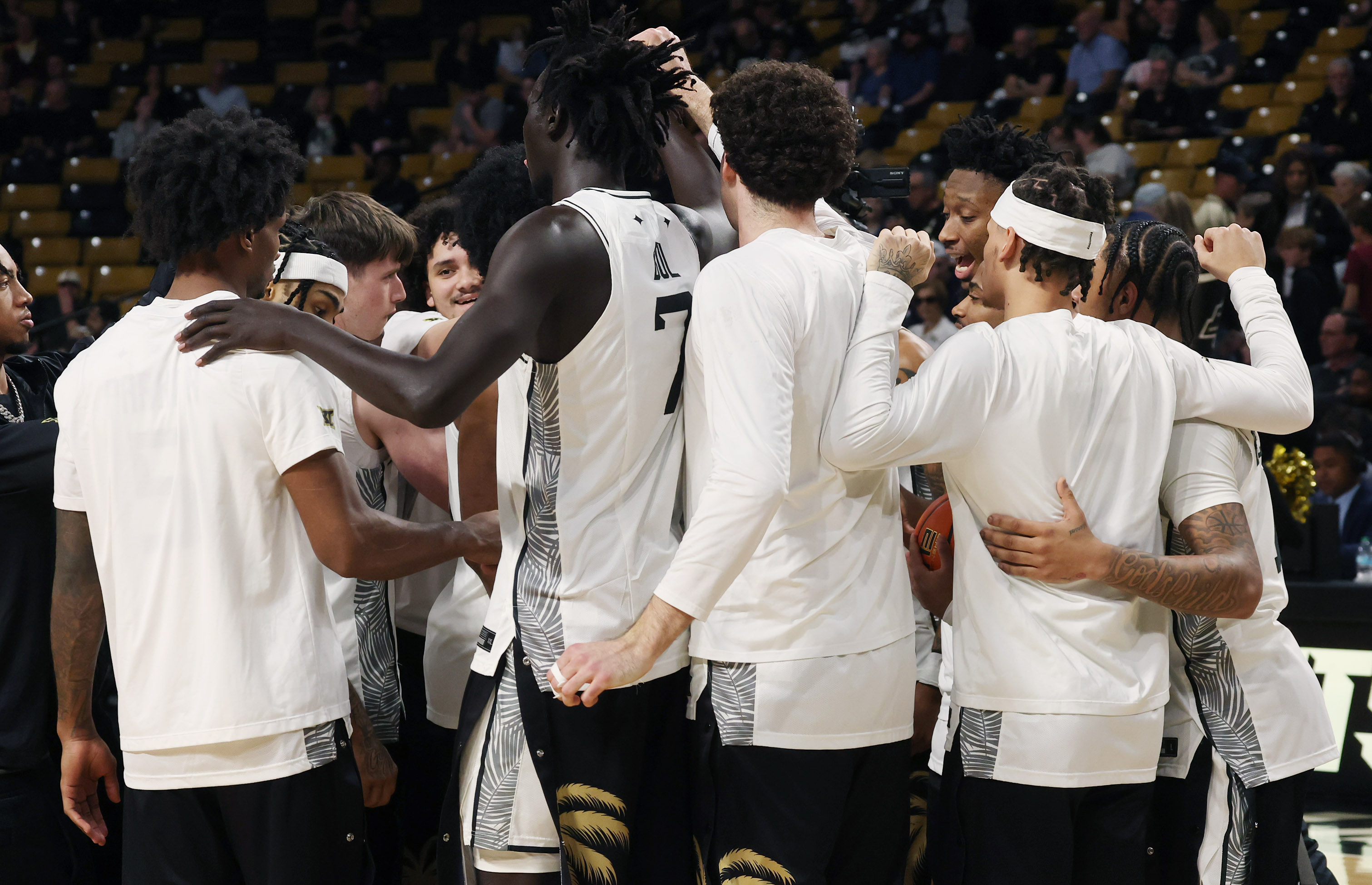 UCF players gather during the TCU at UCF college basketball...