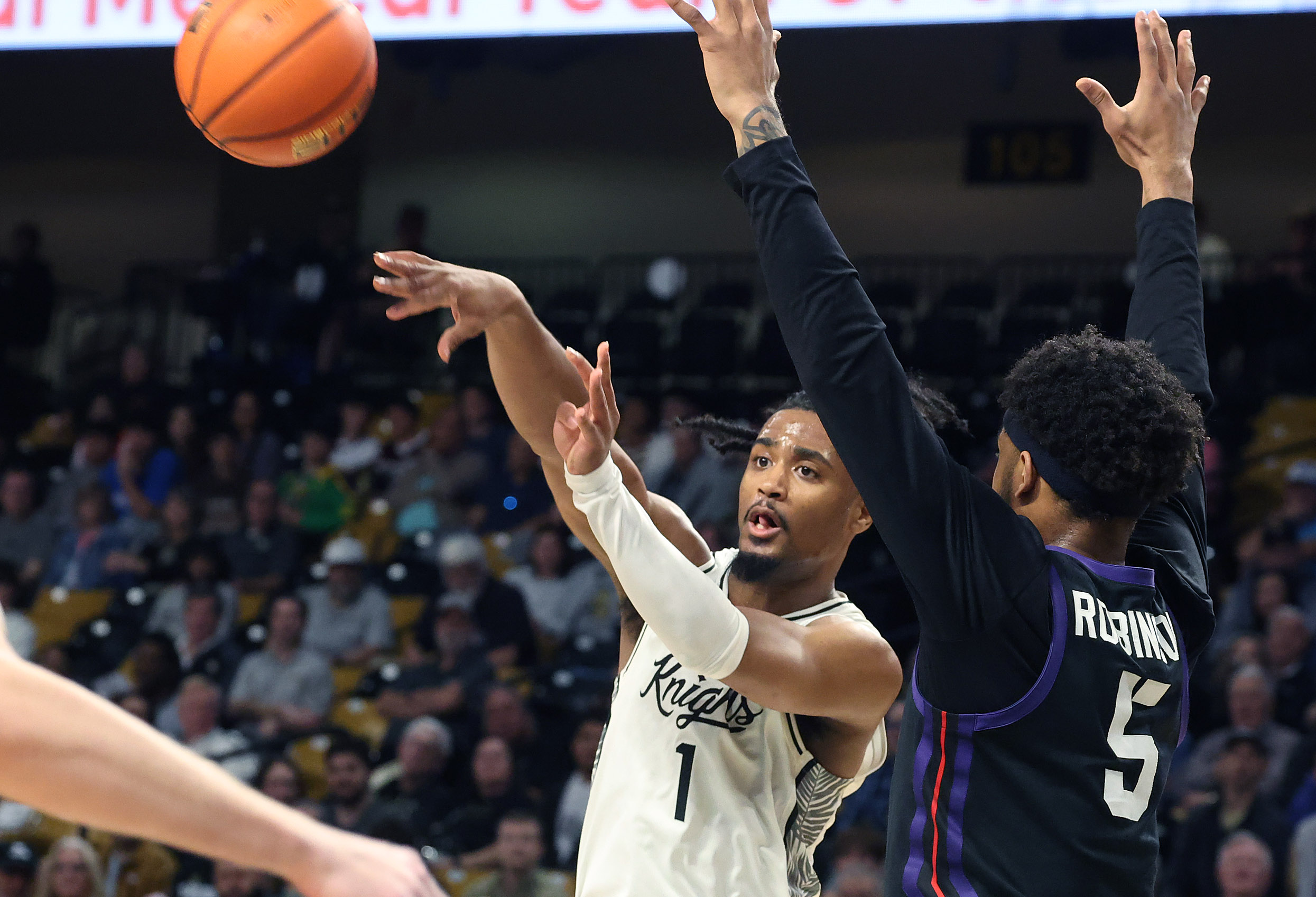 UCF guard Themus Fulks (1) passes in front of TCU...