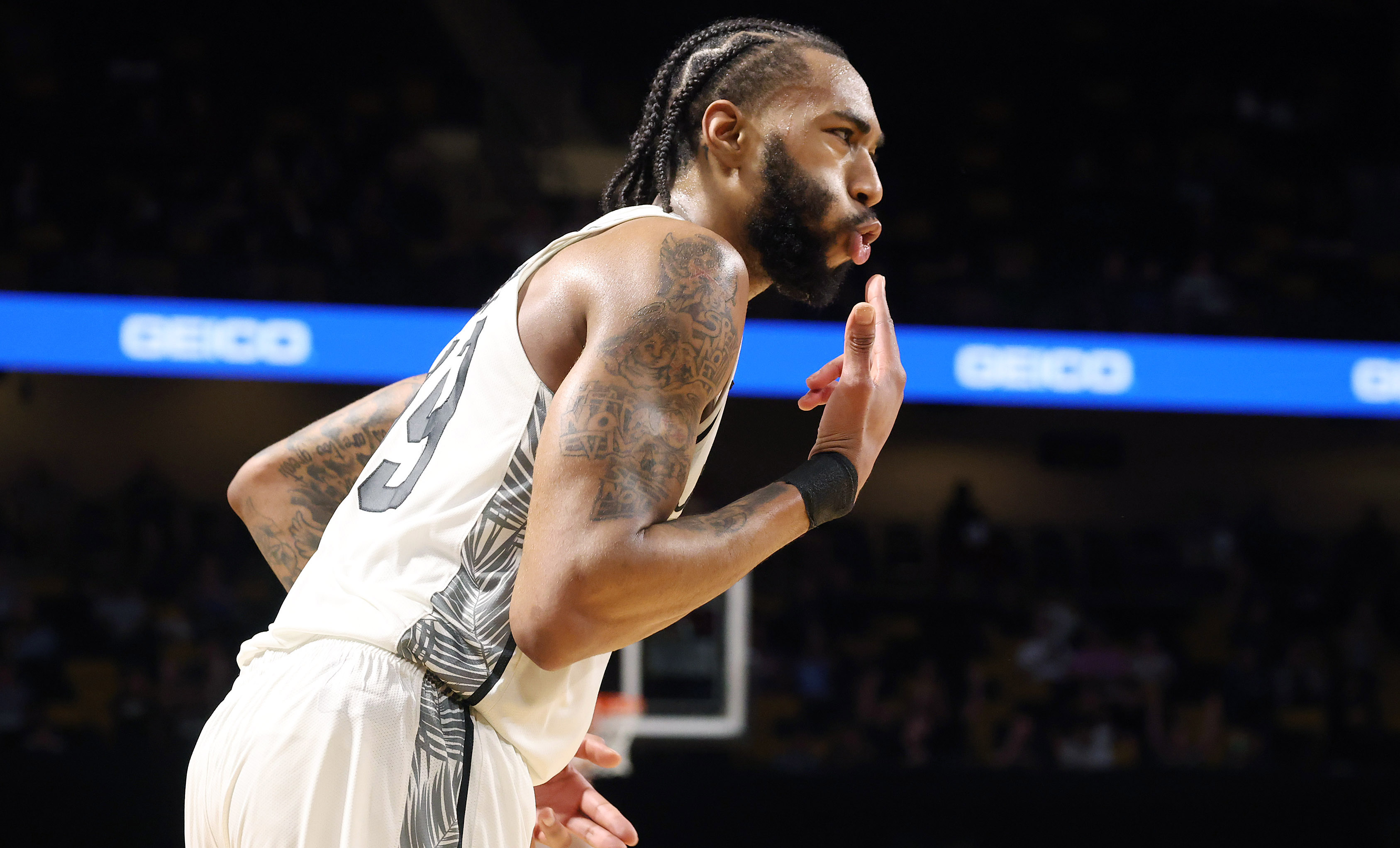 UCF forward Jordan Burks celebrates after making a three point...