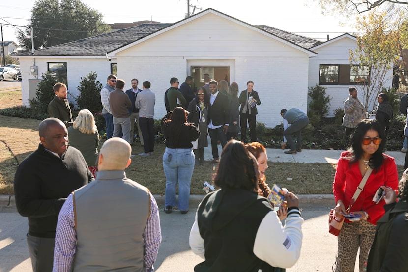 People gather outside of the Associate Leadership Council Class of 2024 project, the...