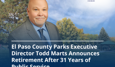 Graphic image with a park in the background and a photo of Todd Marts in the foreground with text reading El Paso county Parks Executive Director Announces Retirement after 31 years of public service.