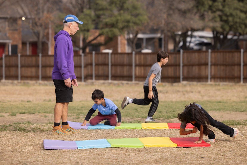 Coach John Kevin Chapman, known as Coach Kevin, watches as Curiosity Studio students...