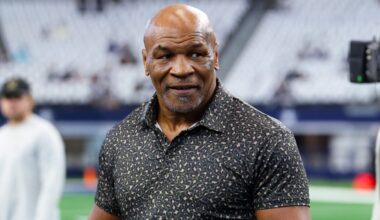 Sep 15, 2024; Arlington, Texas, USA; Boxer Mike Tyson on the field before the game between the Dallas Cowboys and New Orleans Saints at AT&T Stadium.