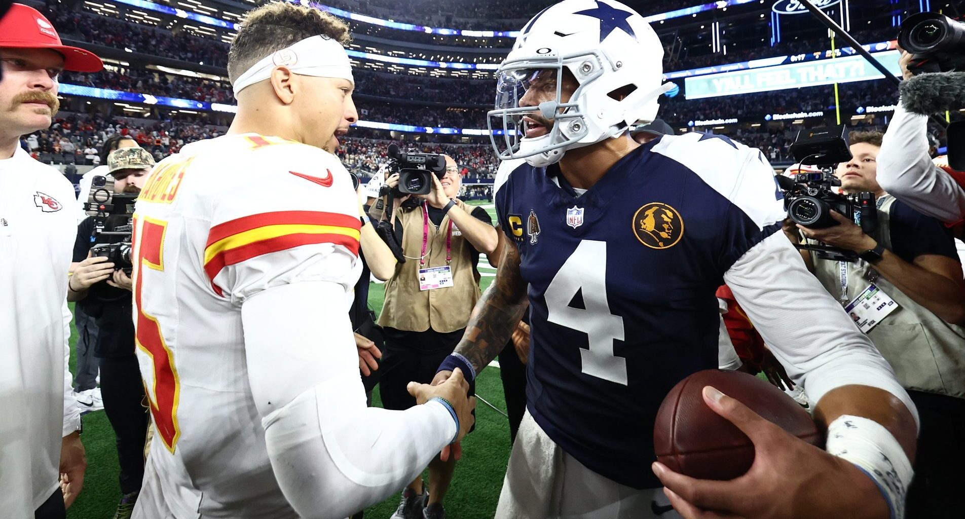 Nov 27, 2025; Arlington, Texas, USA; Kansas City Chiefs quarterback Patrick Mahomes (15) and Dallas Cowboys quarterback Dak Prescott (4) greet each other after the game at AT&T Stadium.