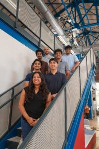 image of seven students standing on a stairwell