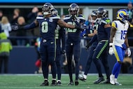 Seattle Seahawks linebacker DeMarcus Lawrence (0) celebrates after sacking Los Angeles Rams...