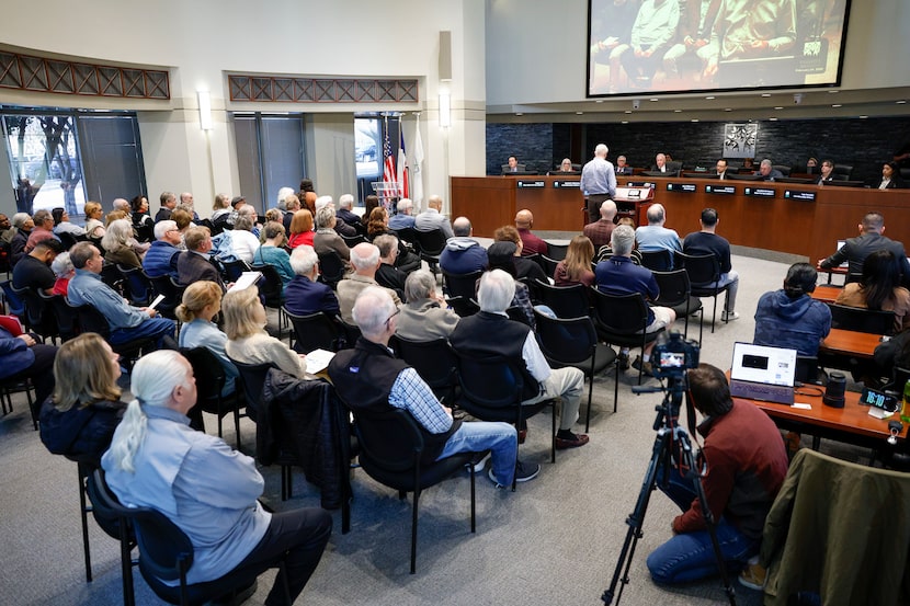 Attendees pack council chambers during a special called city council meeting regarding a...