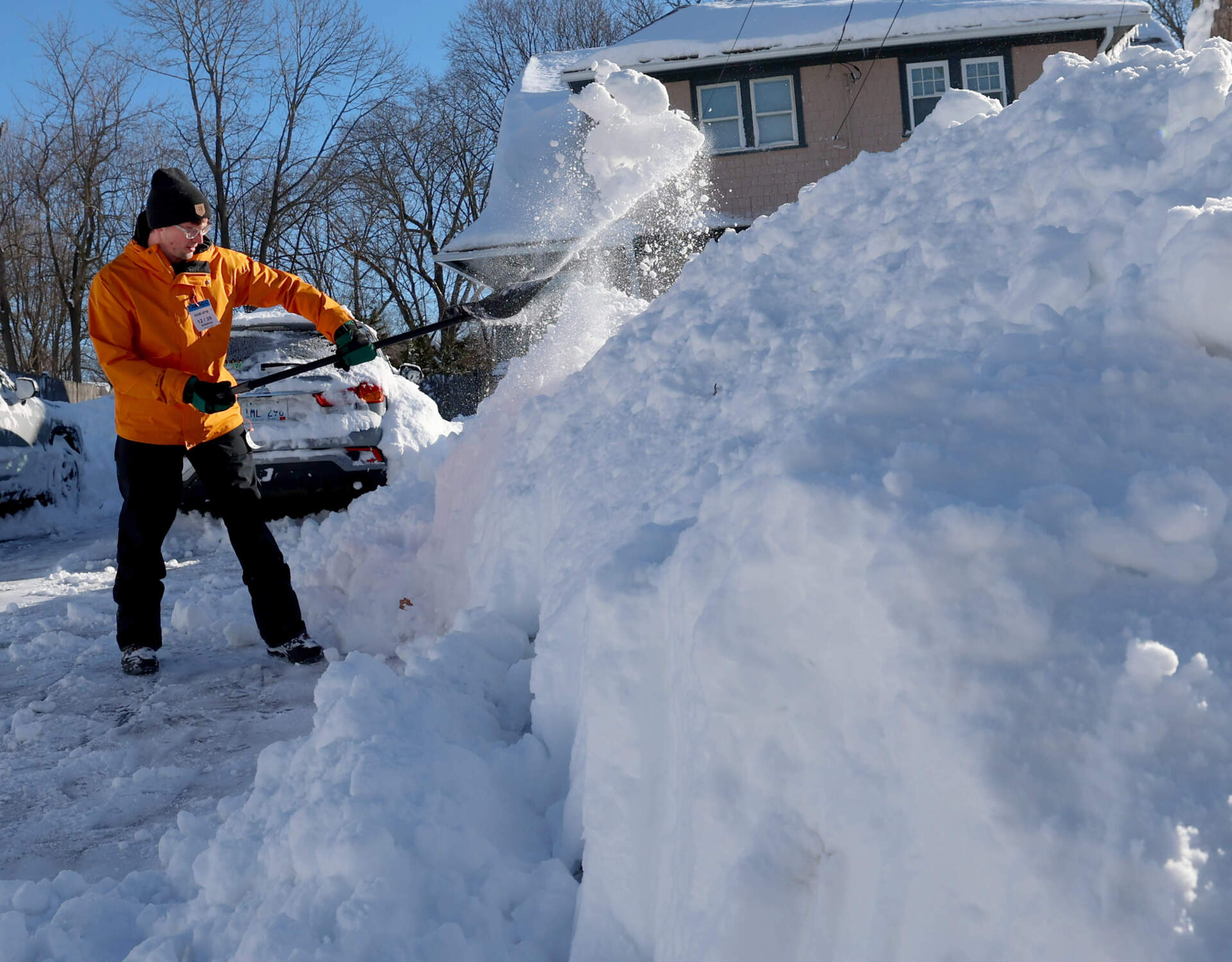 Jeremy Beaudoin shovels his driveway, Tuesday, Feb. 24, 2026 in Warwick, R.I. (Mark Stockwell/AP)