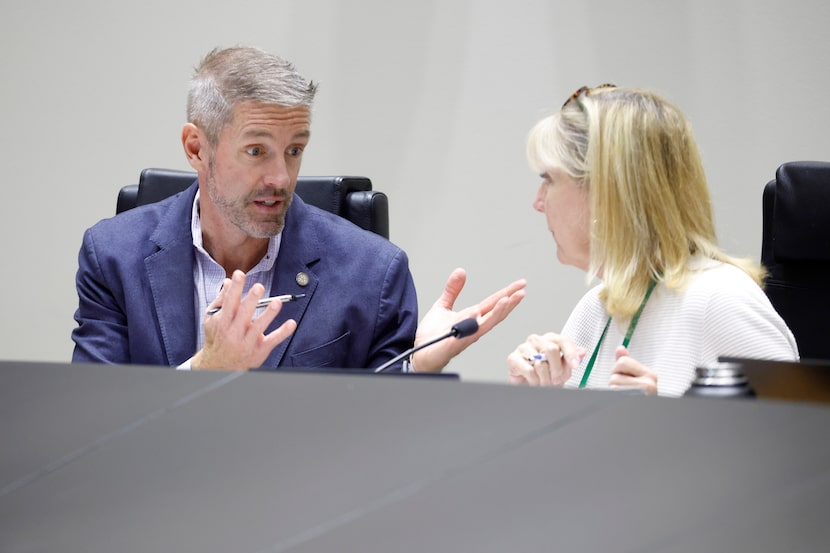 Dallas City Council's Finance Committee Chair Chad West (left) visits with Vice Chair Kathy...