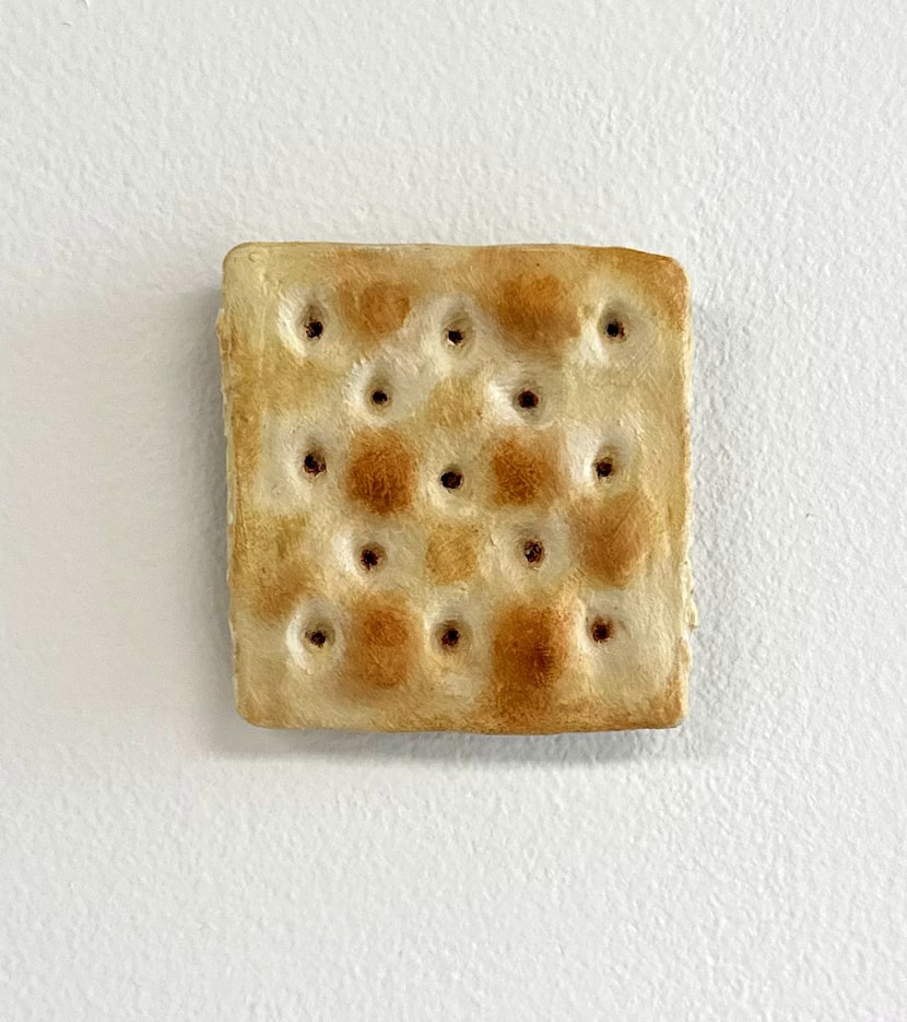 Tamara Johnson’s hyperrealistic 2023 work "Cracker 2" features a saltine cracker crafted...