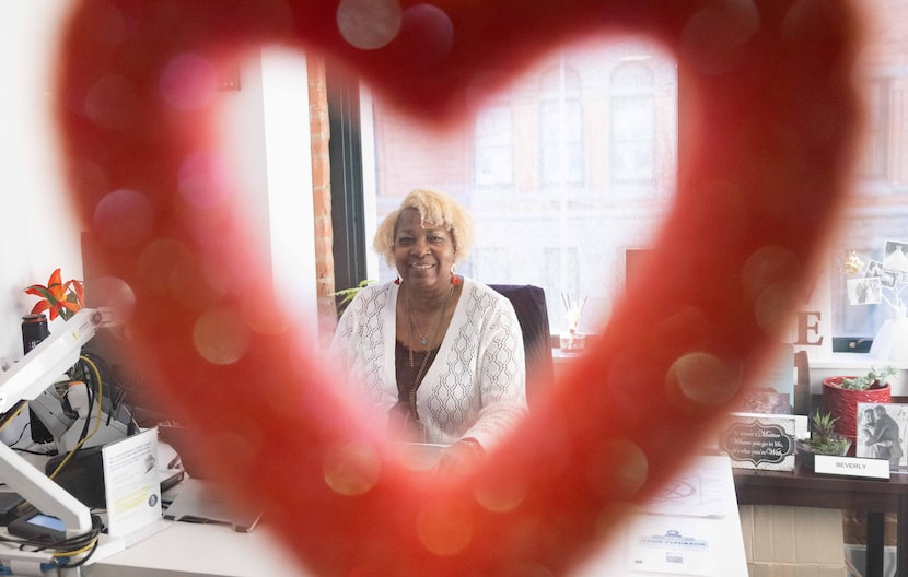 Deputy clerk Beverly Hastings seen through a Valentine’s Day decoration at the Dallas County...