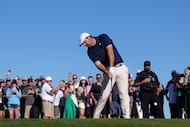 Scottie Scheffler hits his tee shot at the 15th hole during the first round of the Phoenix...