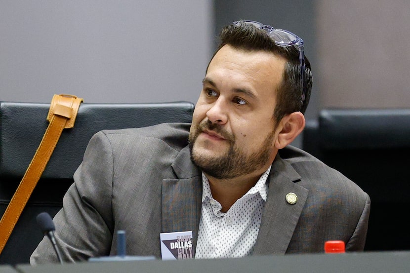 Dallas City Council member Adam Bazaldua wears a “Save Dallas City Hall” button during a...