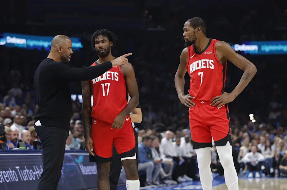 Oct 21, 2025; Oklahoma City, Oklahoma, USA; Houston Rockets head coach Ime Udoka talks to forward Tari Eason (17) and forward Kevin Durant (7) during a break in play against the Oklahoma City Thunder during the first half at Paycom Center. Mandatory Credit: Alonzo Adams-Imagn Images