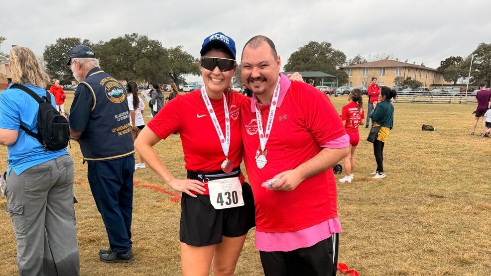 CBS Austin's Chikage Windler with Asa, one of the individuals served by Community Options. Asa helped give out medals and awards to Cupid's Chase 5K finishers. (photo: Chikage Windler)
