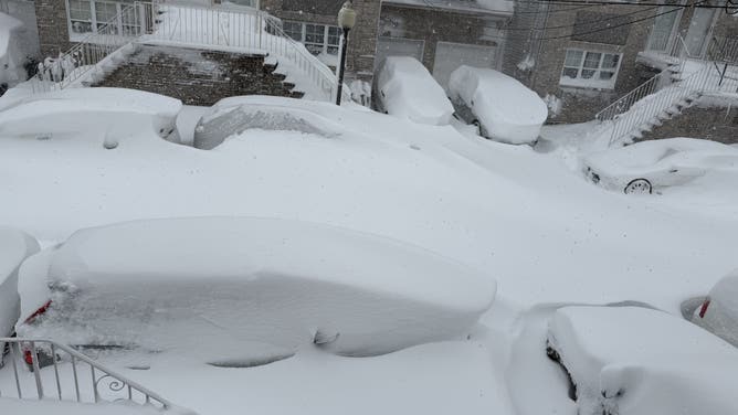 Snow covers cars and sidewalks during the blizzard in Staten Island.