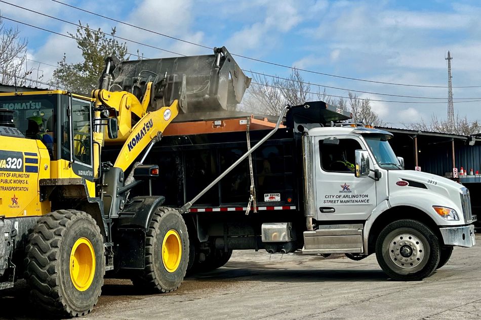 City of Arlington Public Works employees load up a sanding truck on Jan. 21, 2026, ahead of expected winter weather. 