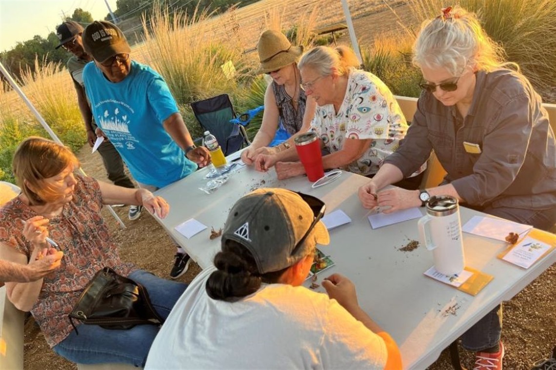 Students at an outdoor class at the Lake Arlington Native Plant and Pollinator Garden.