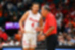 Kingston Flemings and Kelvin Sampson of the Houston Cougars talking during a college basketball game.