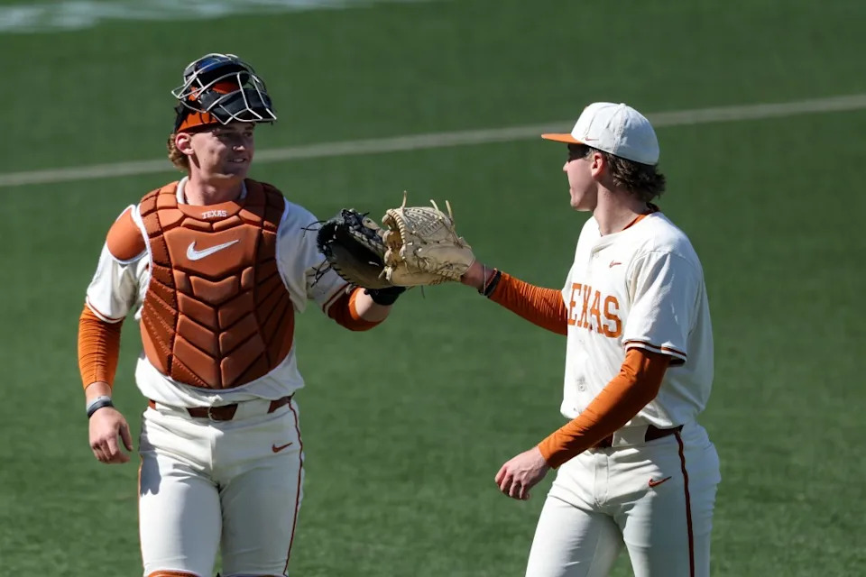AUSTIN, TX – FEBRUARY 22: Pitcher Dylan Volantis #99 of the Texas Longhorns and Catcher Carson Tinney #8 of the Texas Longhorns tap gloves after closing out an inning during the college baseball game between Texas Longhorns and Michigan State Spartans on February 22, 2026, at UFCU Disch-Falk Field in Austin, TX. (Photo by David Buono/Icon Sportswire via Getty Images)