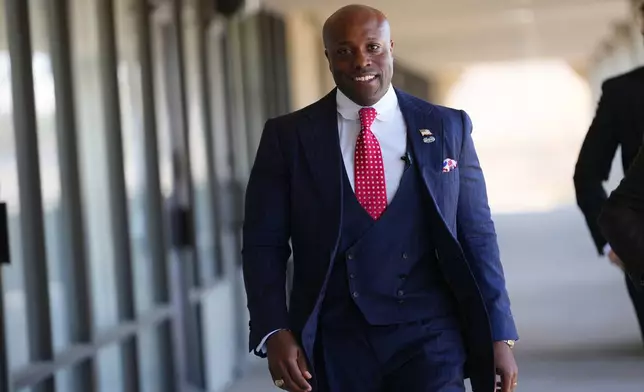 U.S. Rep. Wesley Hunt, R-Texas, arrives at a campaign event, Monday, Feb. 16, 2026, in Dallas. (AP Photo/Julio Cortez)