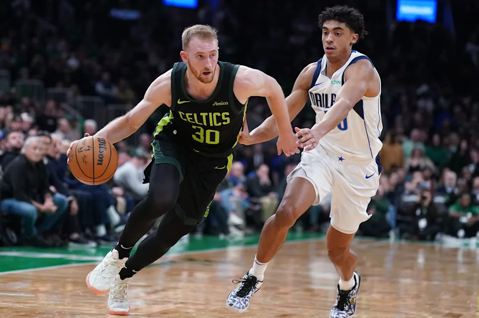 Feb 6, 2025; Boston, Massachusetts, USA; Boston Celtics forward Sam Hauser (30) drives the ball against Dallas Mavericks guard Max Christie (00) in the second half at TD Garden. Mandatory Credit: David Butler II-Imagn Images