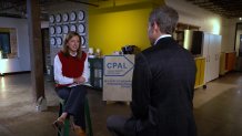 Ashley Flores, left, with the Child Poverty Action Lab in Dallas, talks with NBC 5's Senior Investigative Reporter Scott Friedman about housing costs.