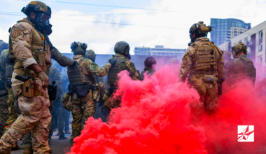Picture of Federal officers from the U.S. Bureau of Prisons, U.S. Customs and Border Protection, U.S. Border Patrol, Homeland Security Investigations and U.S. Immigration and Customs Enforcement provide security for the ICE facility in Portland Oregon on October 4, 2025.