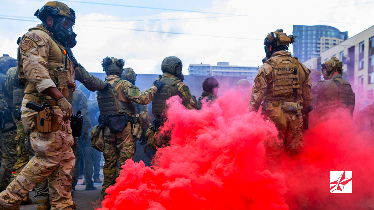Picture of Federal officers from the U.S. Bureau of Prisons, U.S. Customs and Border Protection, U.S. Border Patrol, Homeland Security Investigations and U.S. Immigration and Customs Enforcement provide security for the ICE facility in Portland Oregon on October 4, 2025.