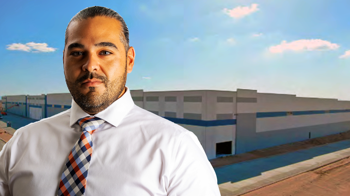 A picture of Rudy Cruz, Jr. in front of a warehouse rumored to be a future ICE detention facility.