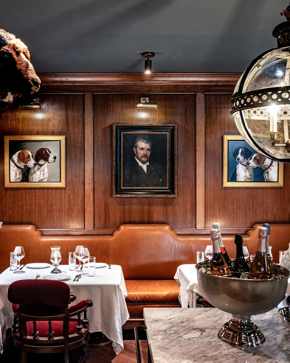 elegant restaurant interior with artwork and dining setup