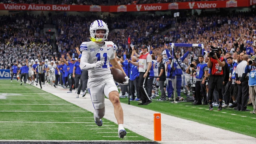 SAN ANTONIO, TX - DECEMBER 28:  Parker Kingston #11 of the BYU Cougars scores on a punt return against the Colorado Buffaloes in the first half in the Valero Alamo Bowl at Alamodome on December 28, 2024 in San Antonio, Texas. (Photo by Ronald Cortes/Getty Images)