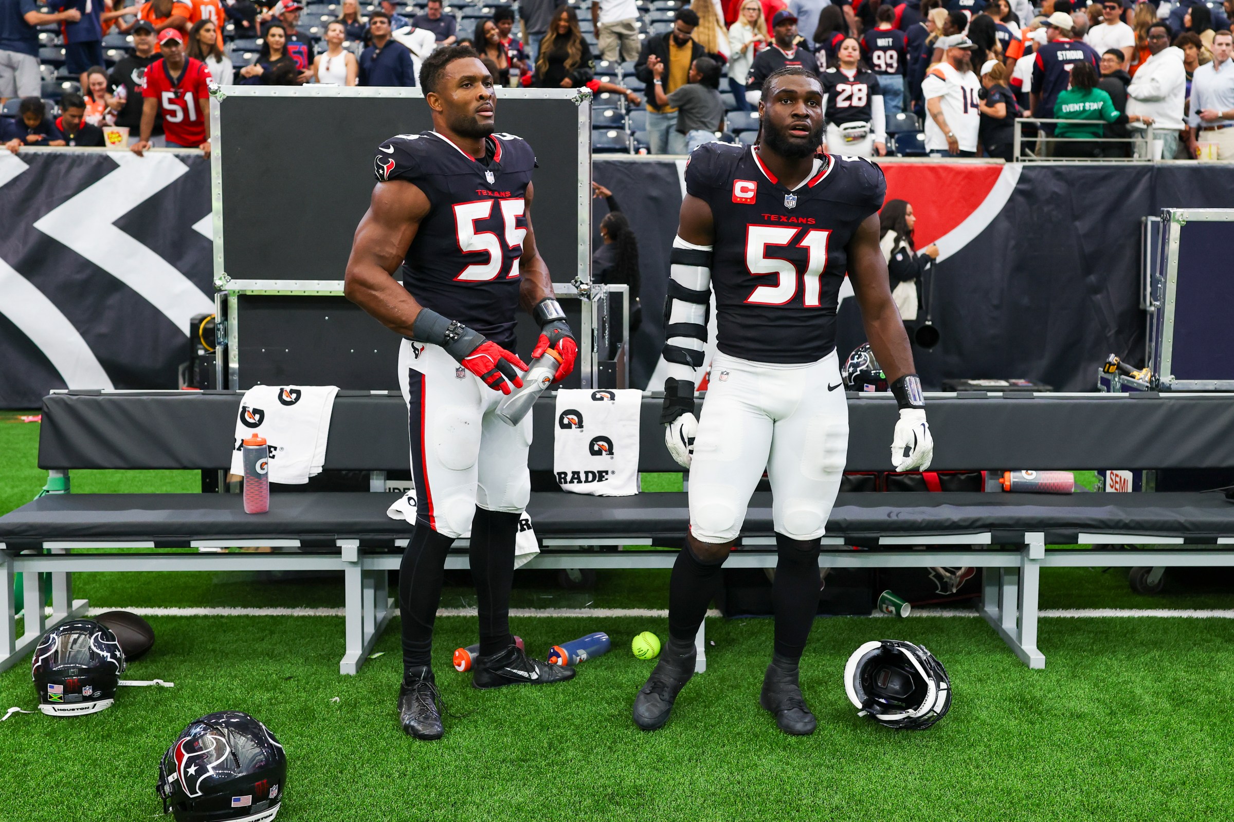 HOUSTON, TEXAS - NOVEMBER 2: Danielle Hunter #55 and Will Anderson Jr. #51 of the Houston Texans stand on the sidelines after an NFL football game against the Denver Broncos at NRG Stadium on November 2, 2025 in Houston, Texas. (Photo by Logan Bowles/Getty Images)